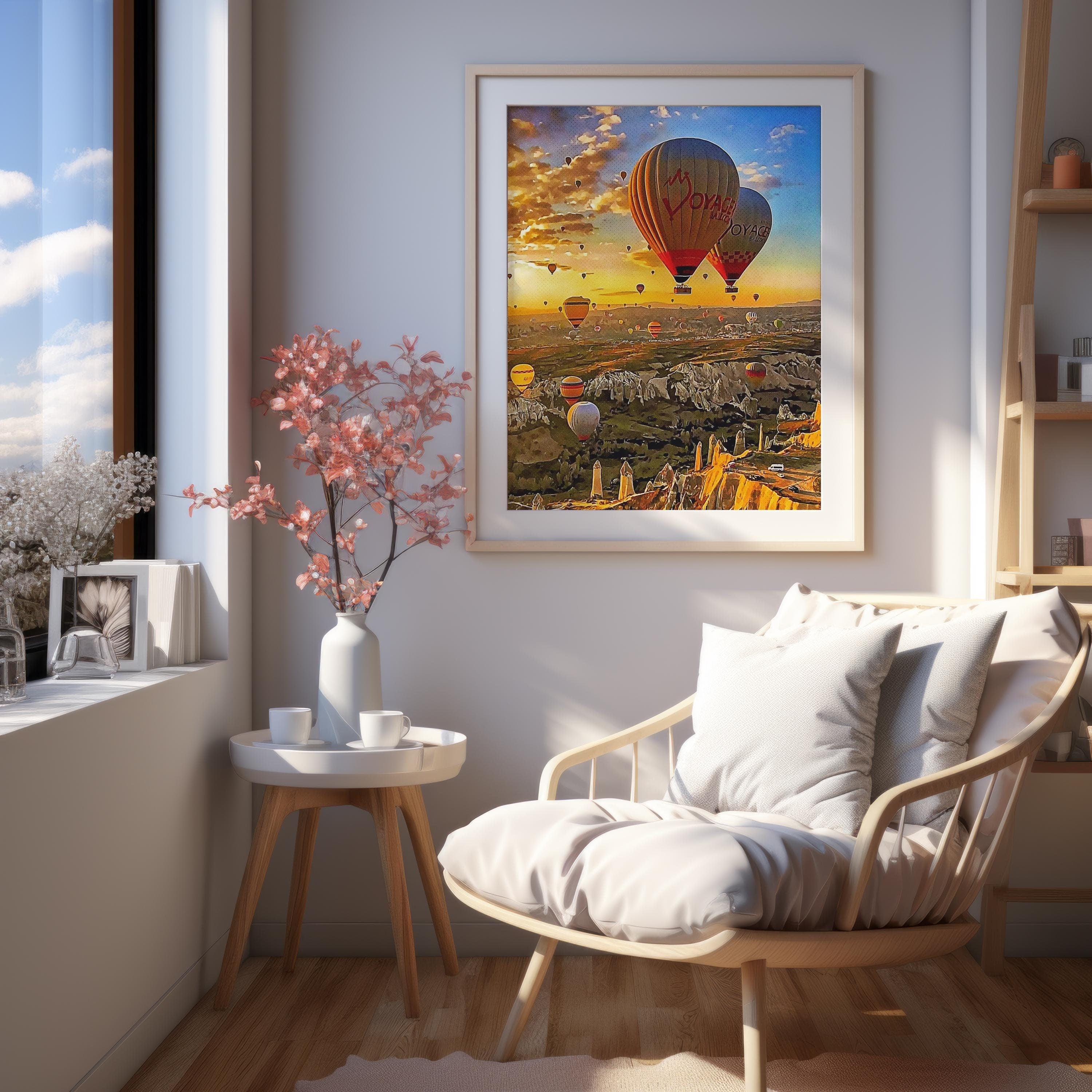 Cappadocia hot air balloon sunset poster in light oak frame above a reading chair by a sunny window
