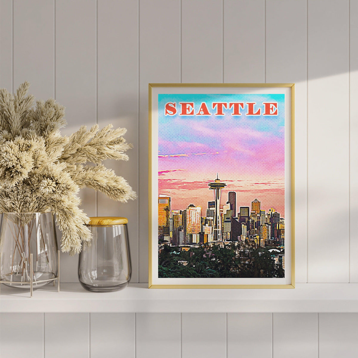 Seattle Space Needle print in slim gold frame on a white shelf with dried pampas grass